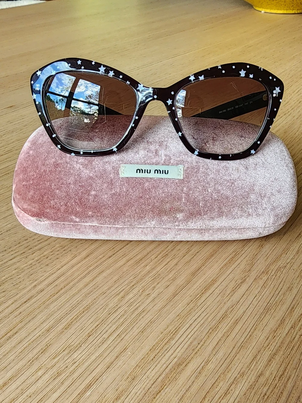 Miu Miu Women's Cat-Eye Black Sunglasses With White Star Pattern